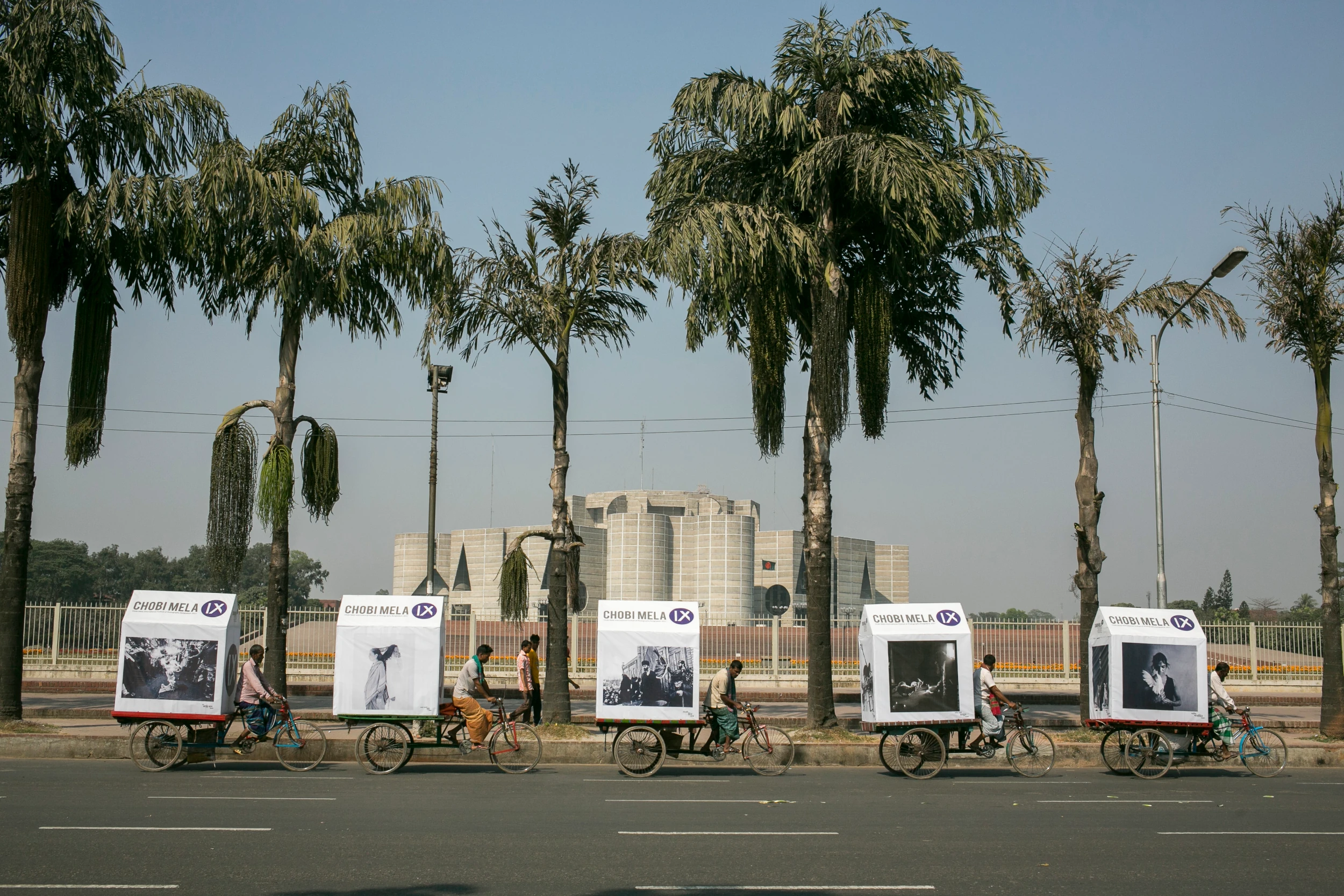 Chobi Mela's trademark outreach tool, the mobile exhibition on rickshaw vans plies over Dhaka city, Bangladesh. Above: Chobi Mela IX, 2017 (credit Habibul Haque/Drik) Below: Chobi Mela VIII, 2015 (credit Wahid Adnan/Drik). Images