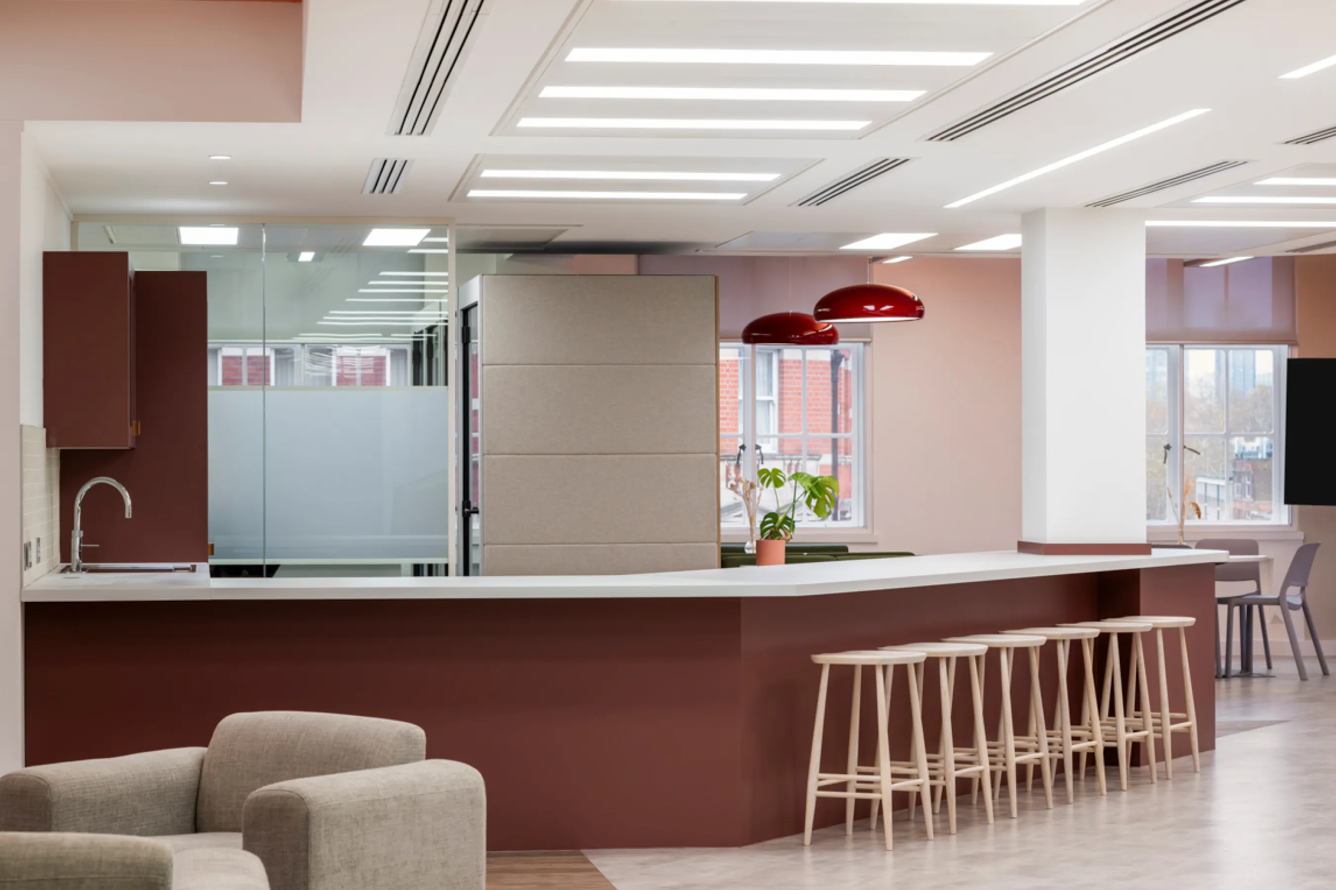Café-style office area with curved counter and seating.