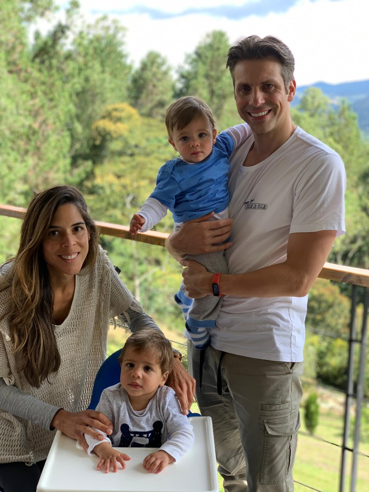 Maria and her family pose for a family portrait.
