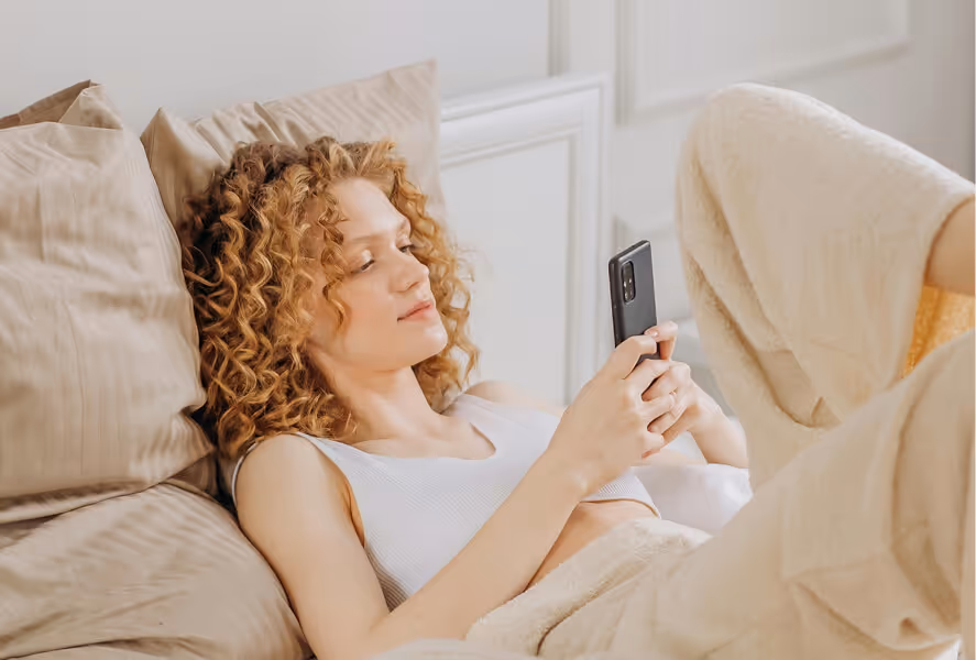 Photo of a young woman using a smartphone