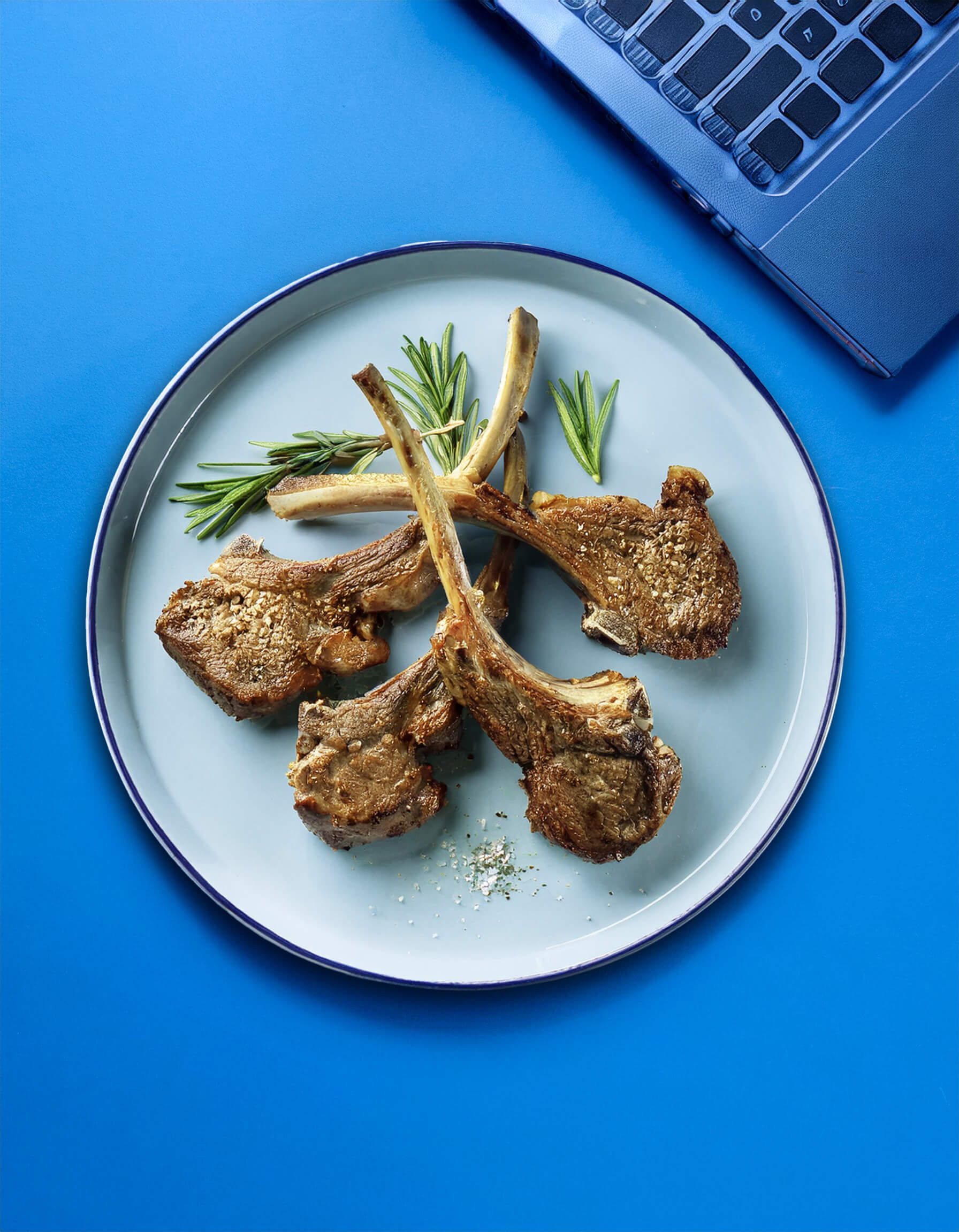 A plate of cooked lamb chops