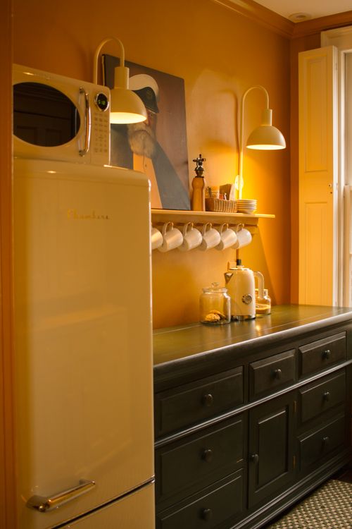 butler's pantry style room for guests with fridge, microwave, electric kettle, cutlery, glassware and plates