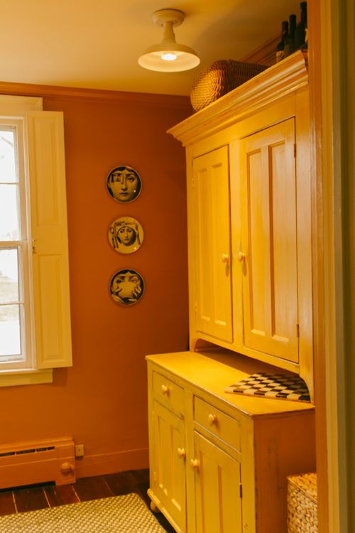butler's pantry style room for guests with fridge, microwave, electric kettle, cutlery, glassware and plates