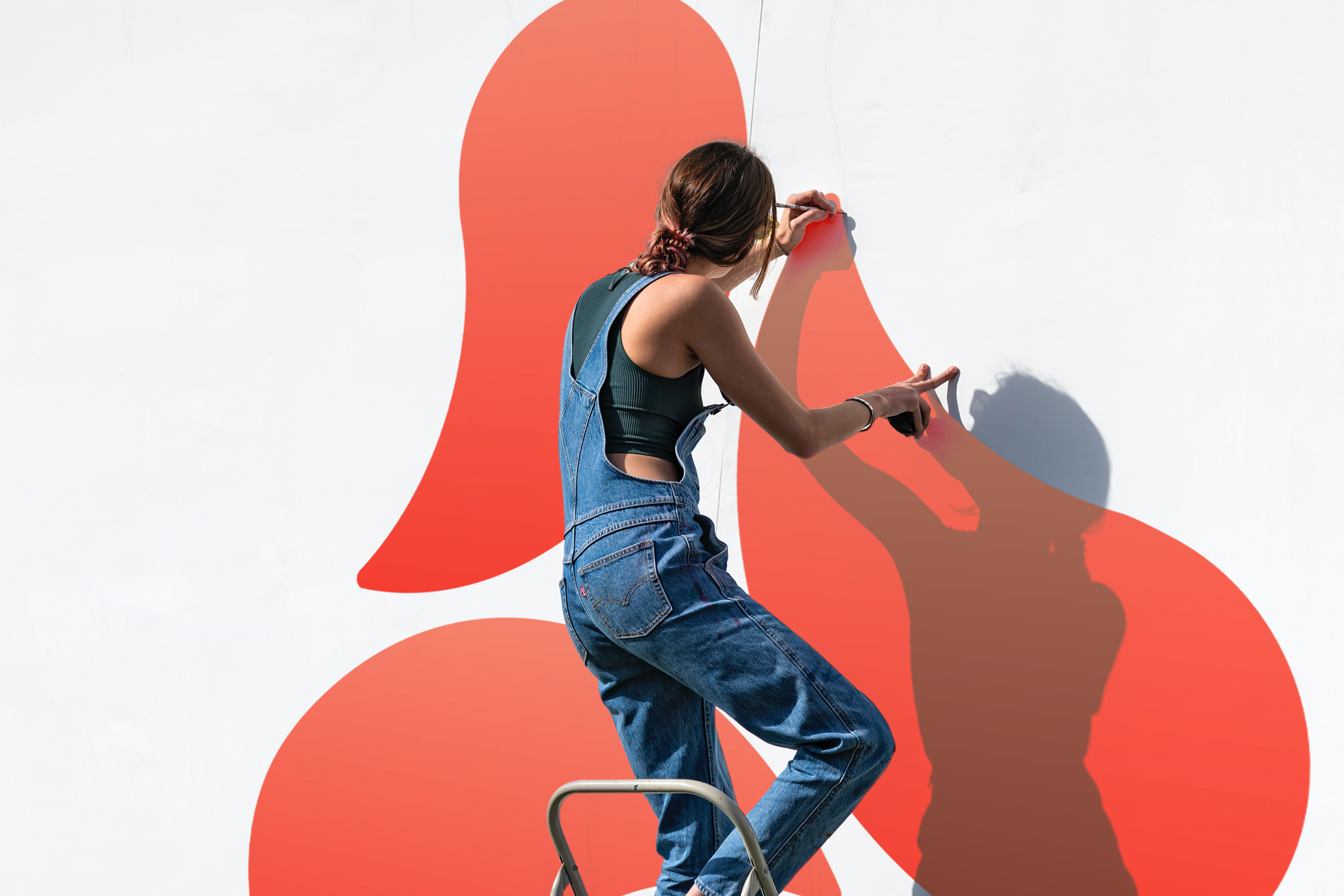 Woman drawing on a wall