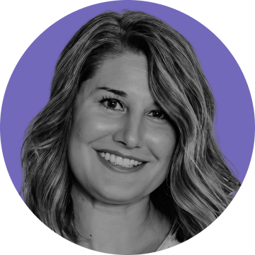 Smiling woman with wavy, shoulder-length hair against a purple circular background.