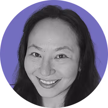 Close-up portrait of a smiling woman with long dark hair against a purple circular background.