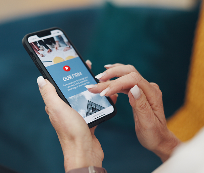 A woman holding her smart phone looking at a pre-roll video ad. 