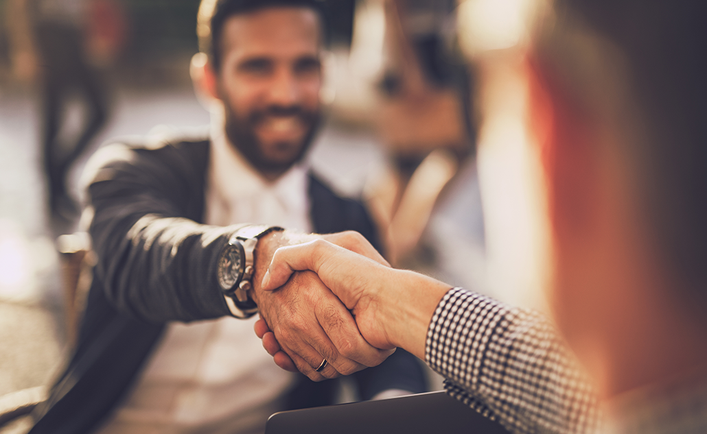 Two people shaking hands.