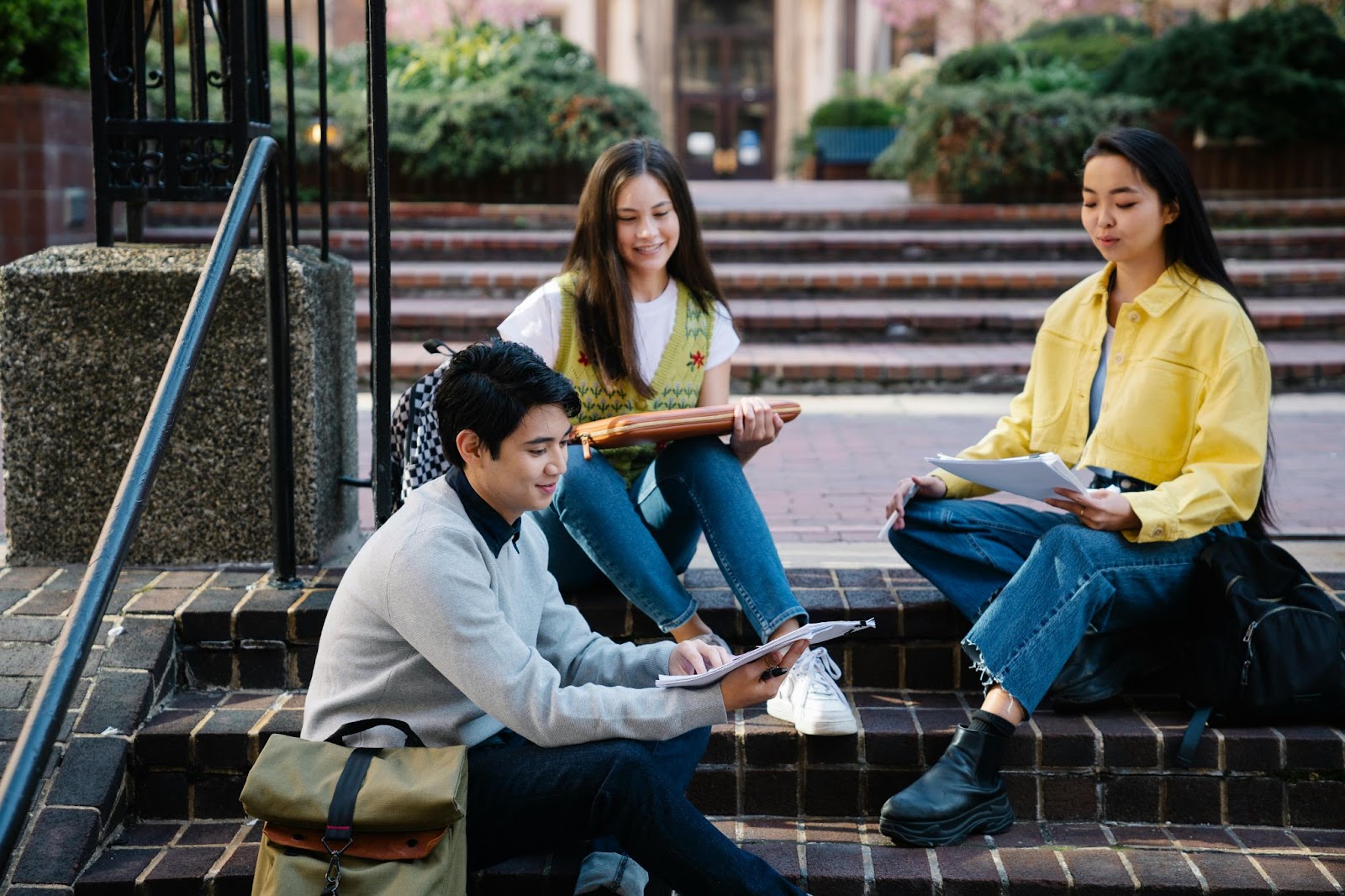 Students sitting on steps socializing