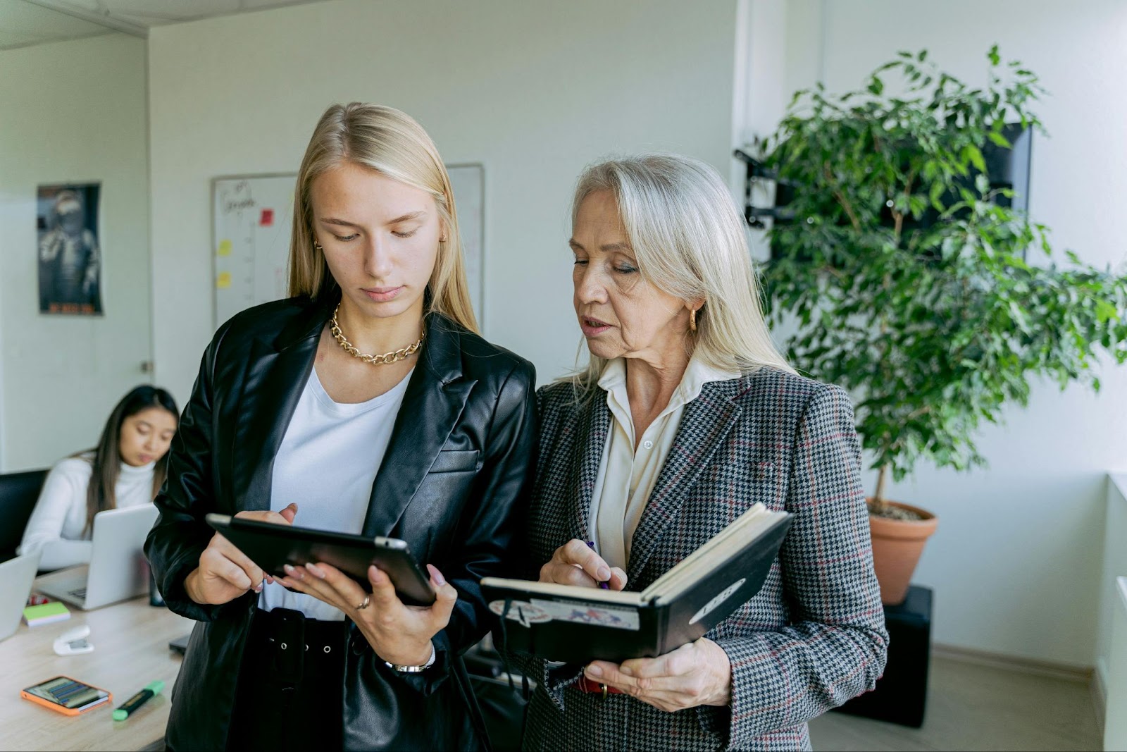 Two women discussing in a business environment