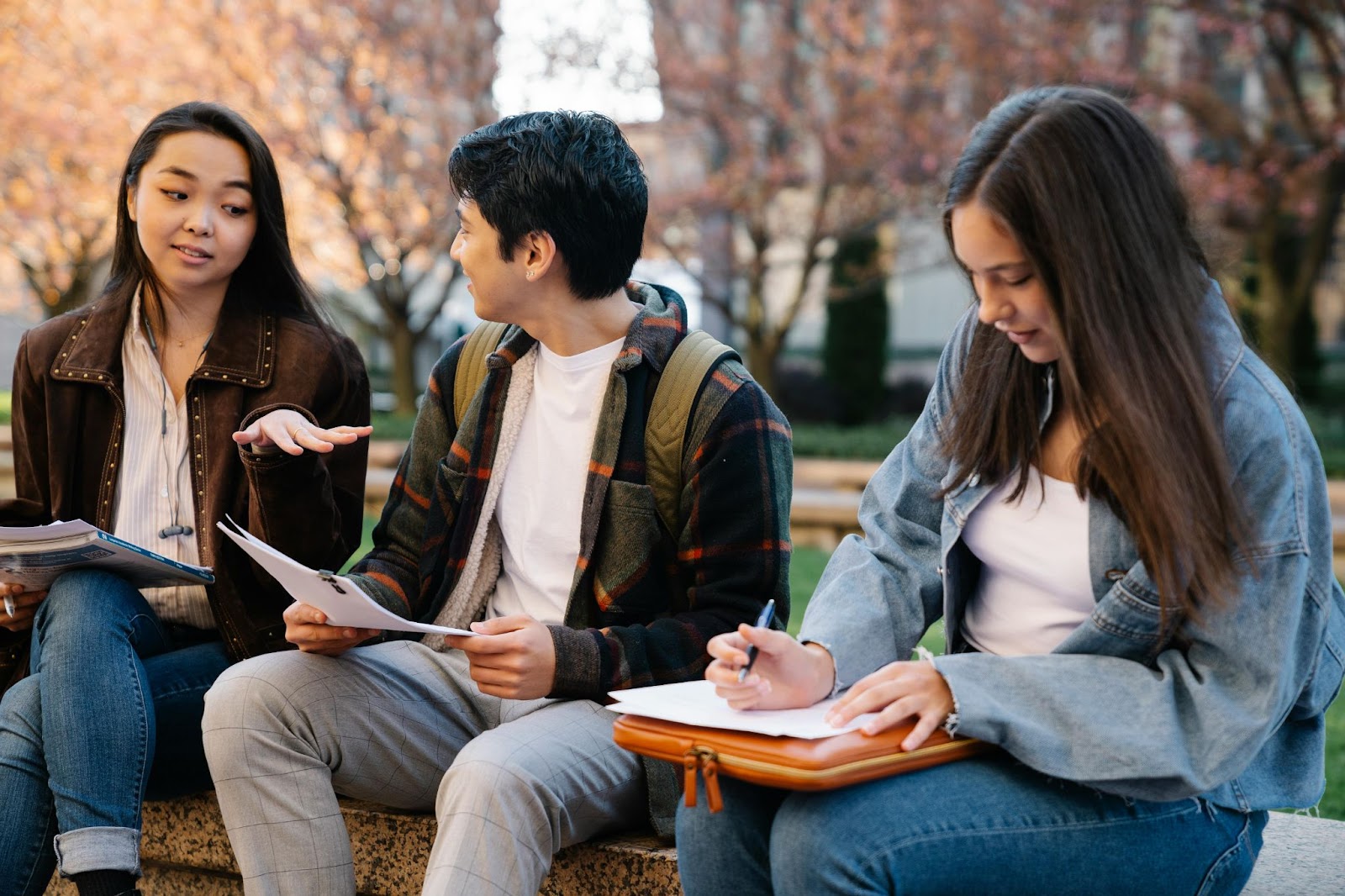 Three college students socializing