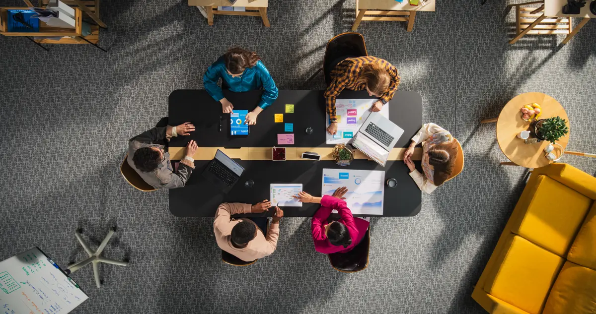 Startup founders planning digital marketing campaigns — using affordable banner design to launch strong.