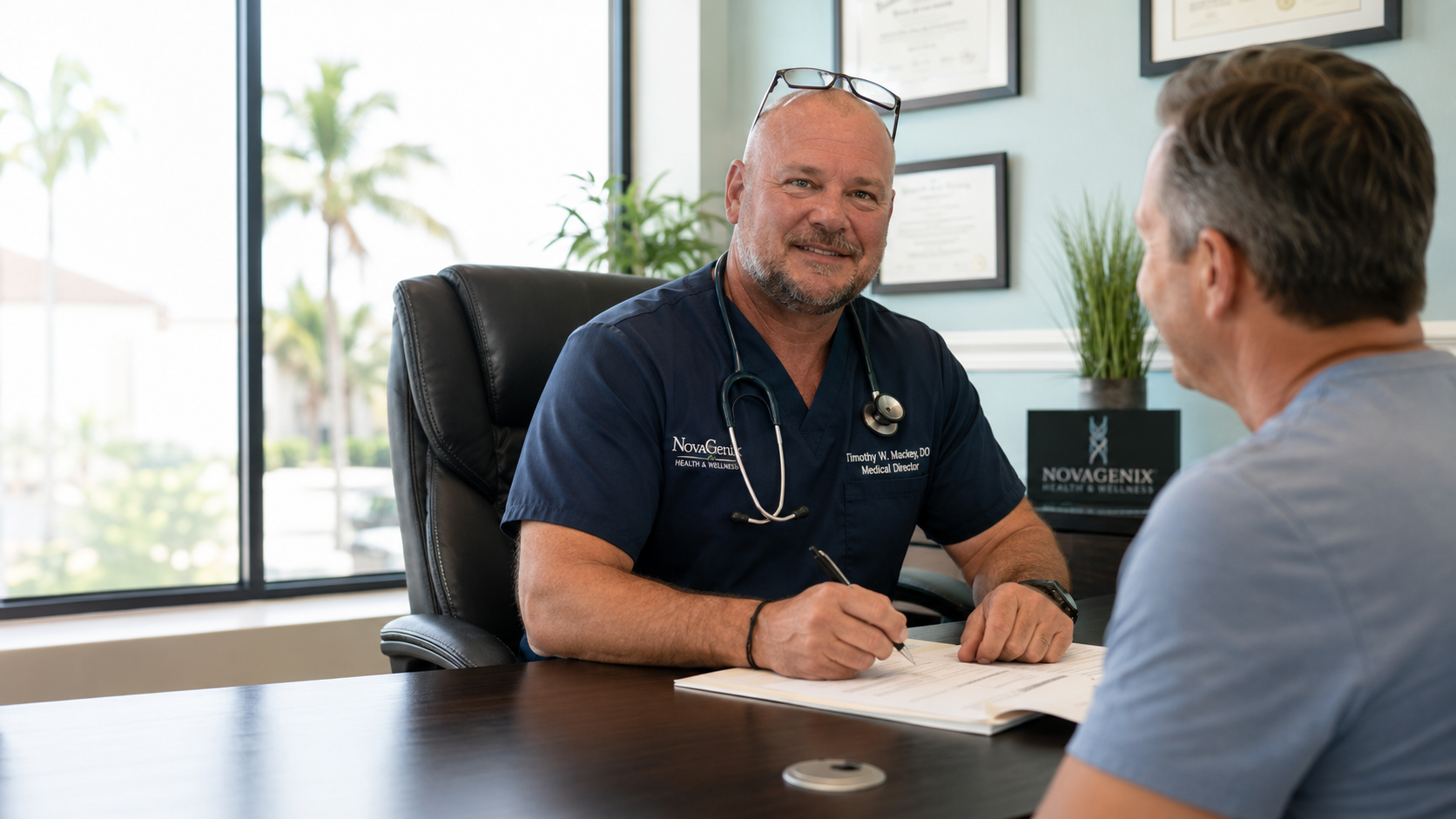 Dr. Timothy W. Mackey discussing Tesamorelin therapy during a patient consultation at NovaGenix in Jupiter, Florida