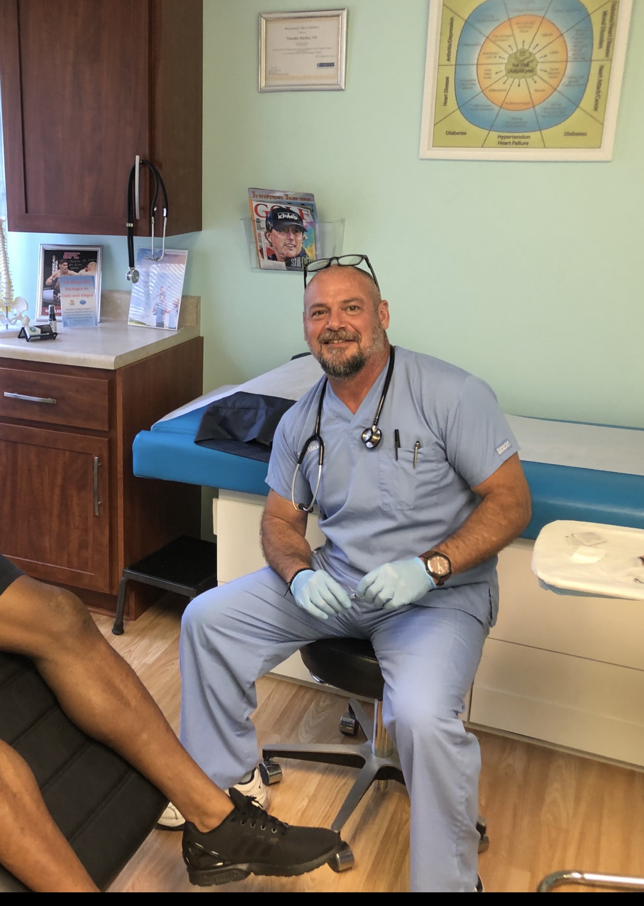 Dr. Timothy Mackey speaking with a patient at NovaGenix in Jupiter