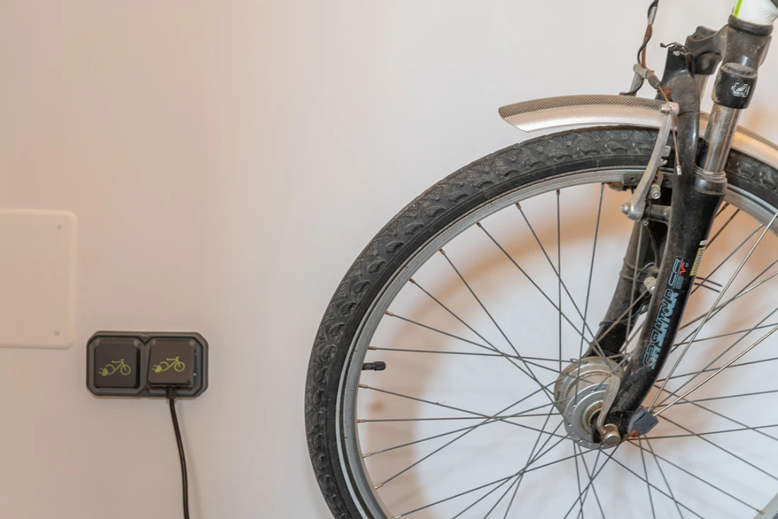 Maintenance and recharging area of bicycles in traditional house Can Moneta Empordà