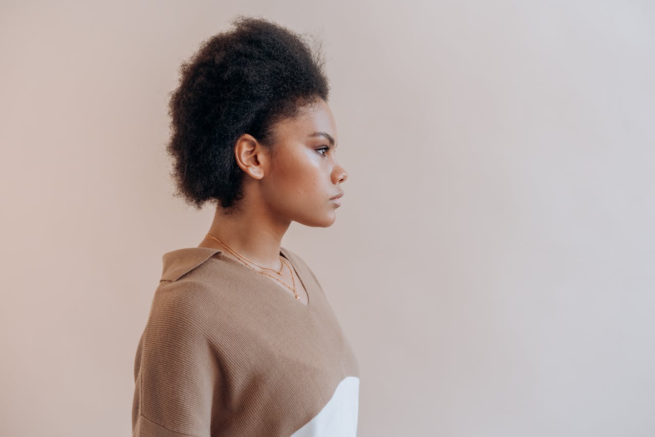 Black Woman in the Beige Sweater