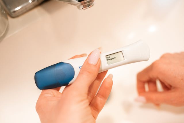Woman Holding Negative Pregnancy Test