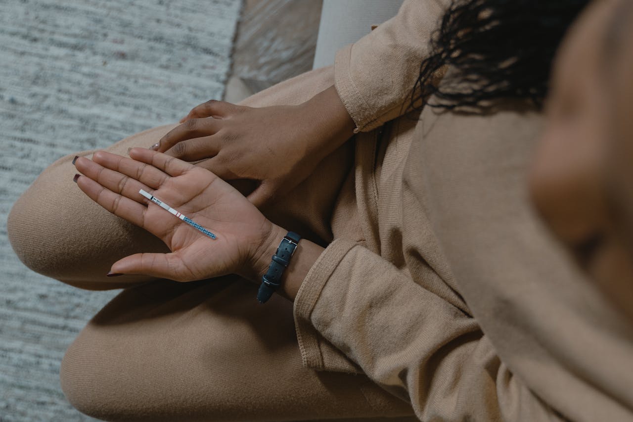 A Person Holding a Pregnancy Strip