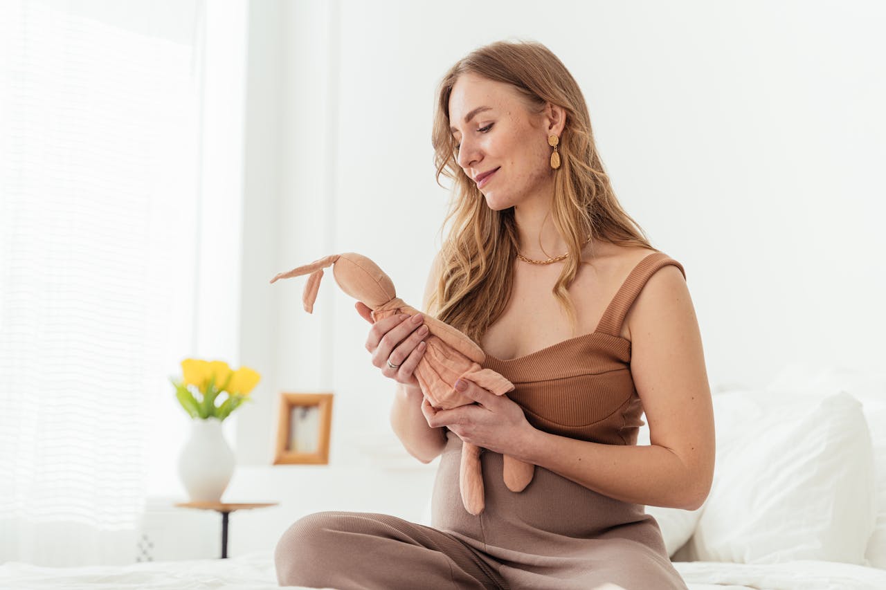 Beautiful Pregnant Woman Holding Stuffed Toy