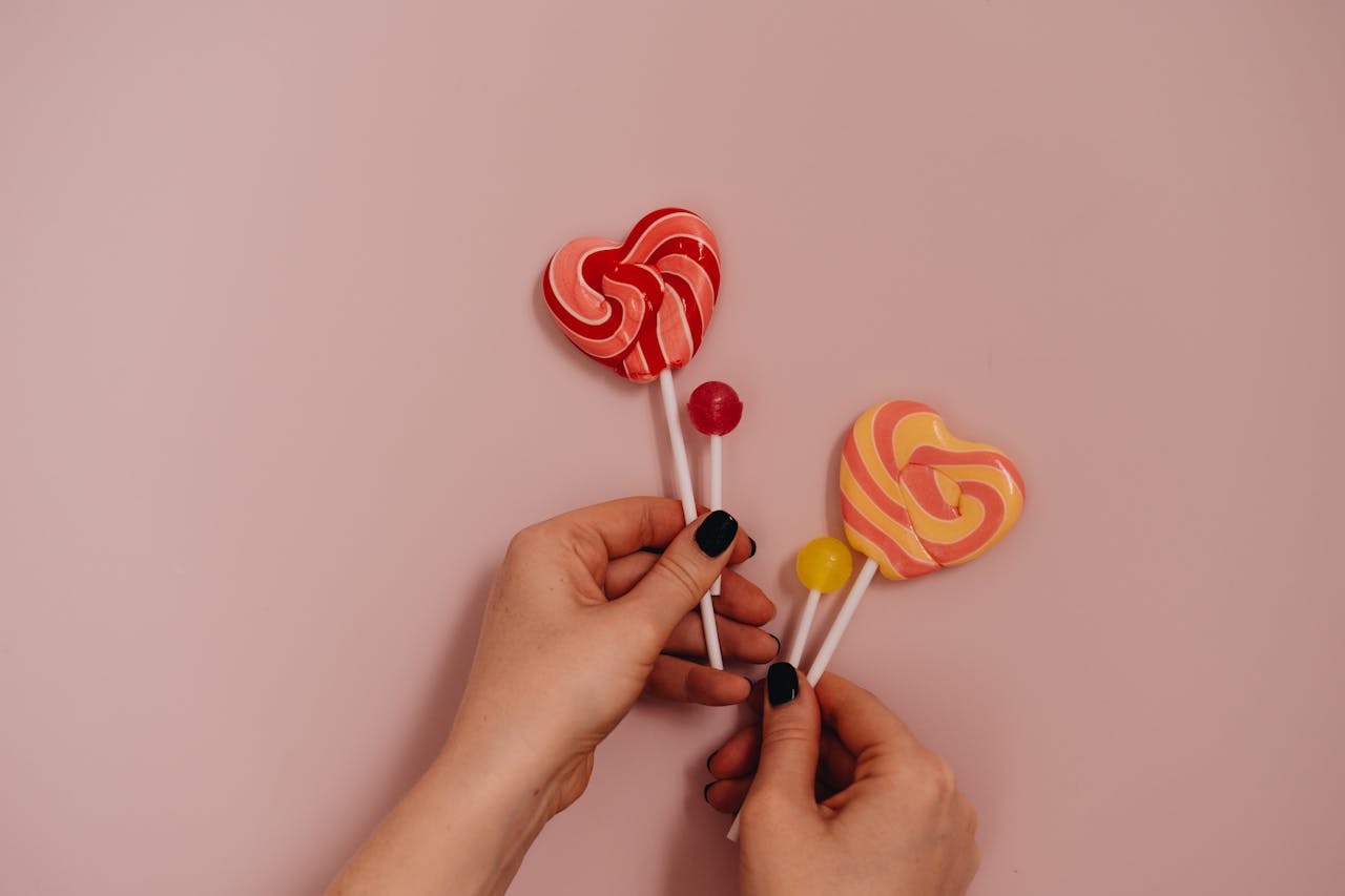 Colorful Lollipops on Pink Background