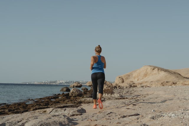 A Woman Jogging at the Coast