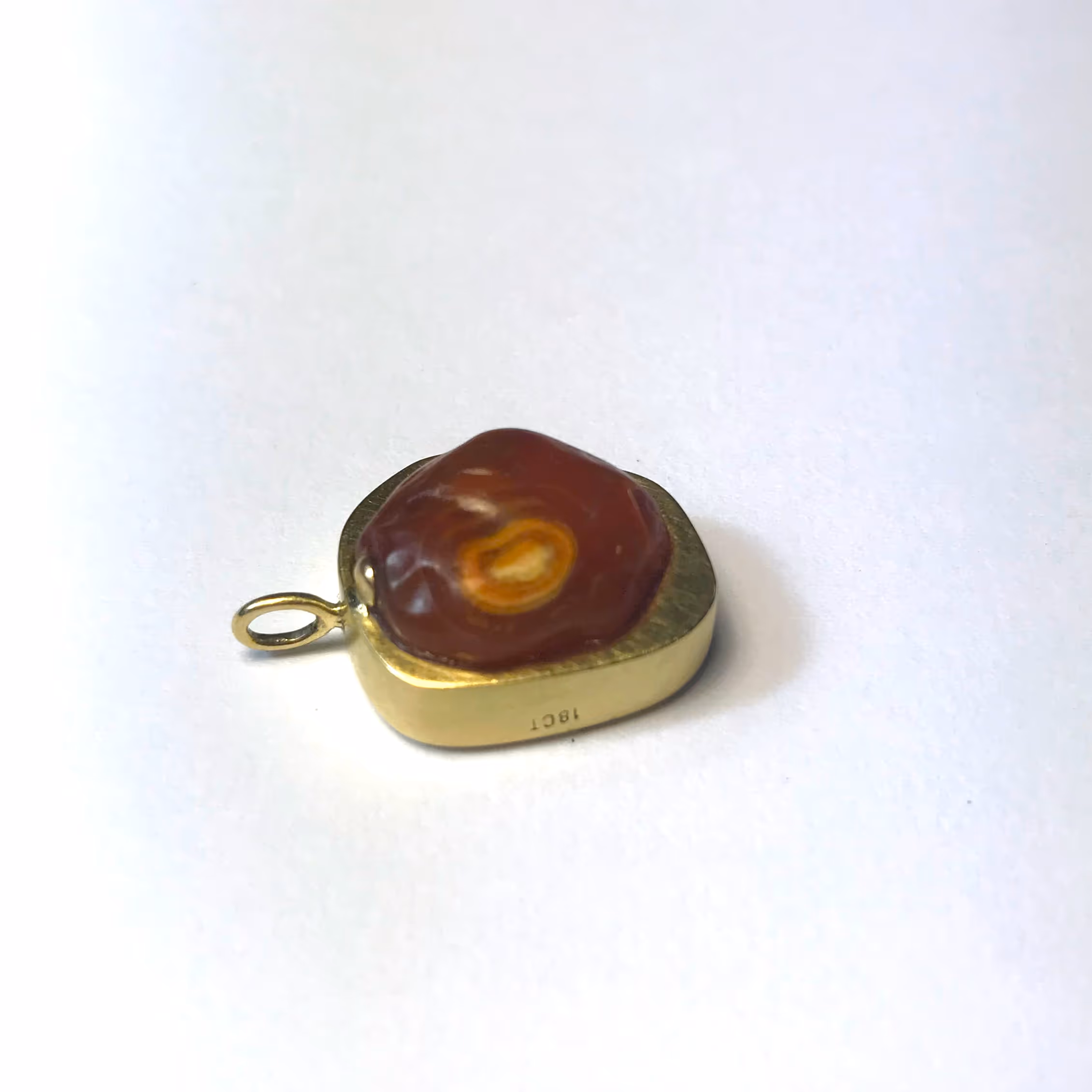 Pendant. 18ct gold with carnelian trading bead from the 1554 Sao Bento shipwreck. Found at Msikaba, Wild Coast, South Africa.