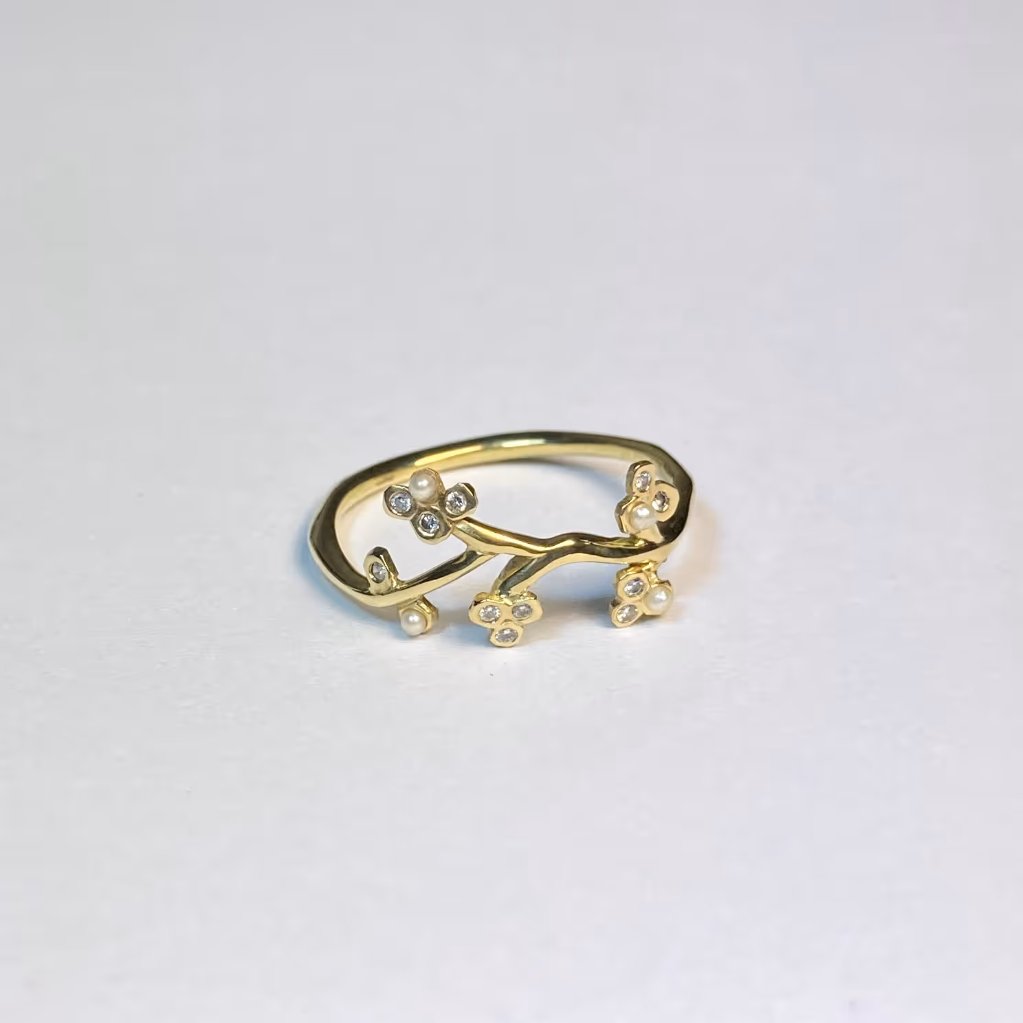 'Cherry blossom’ engagement ring. 18ct gold with diamonds and pearls. 