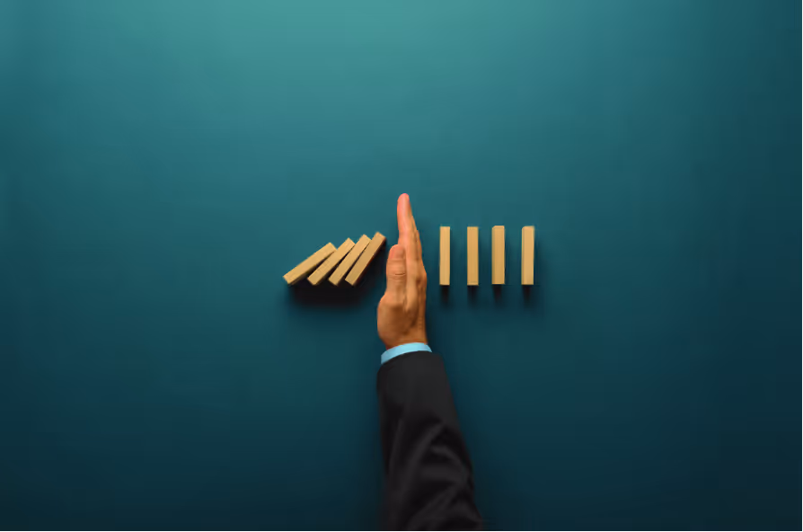 Man holding blocks from falling