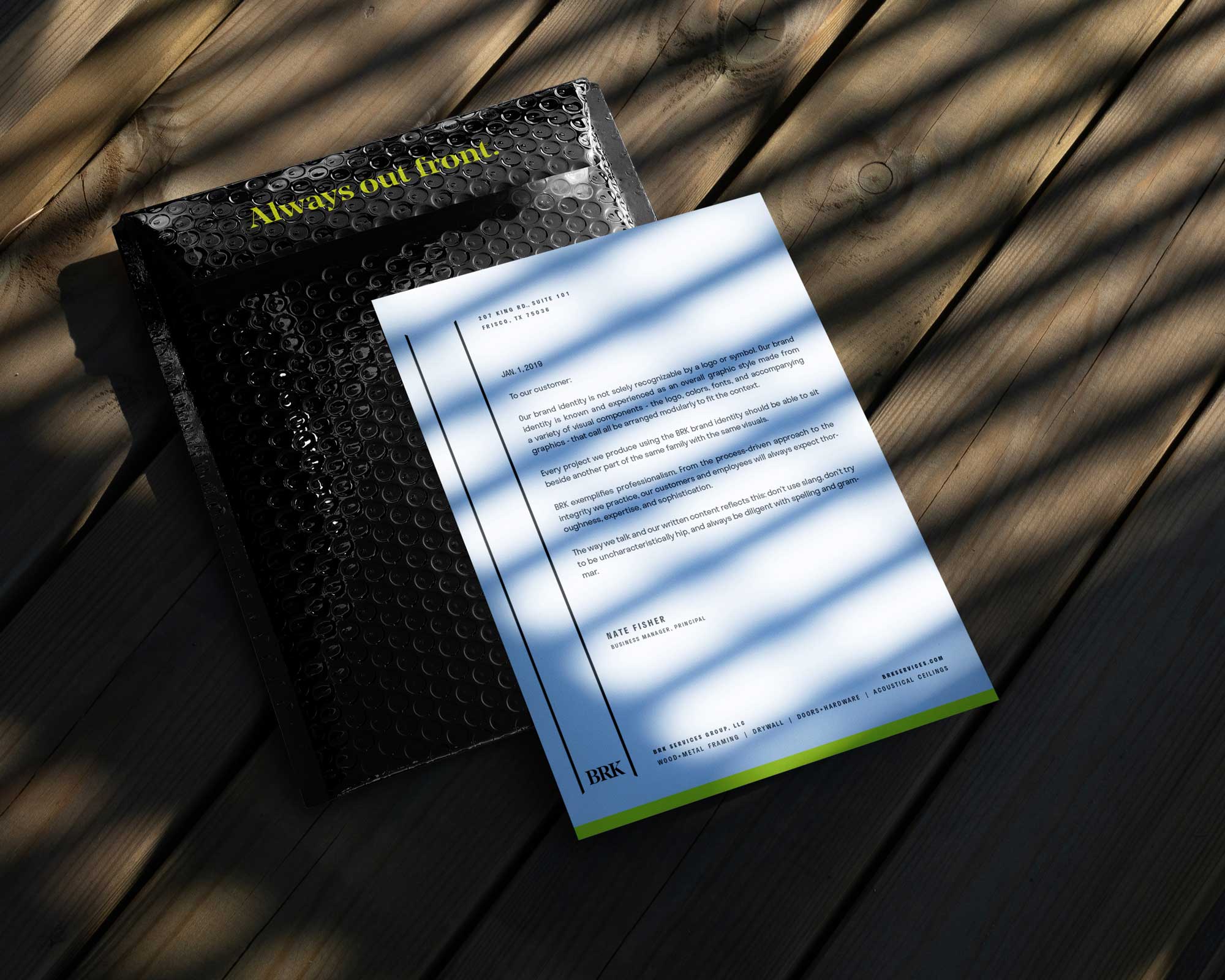 BRK Services branded letterhead and padded envelope
