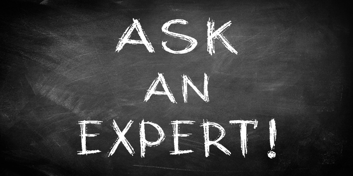 Chalkboard background with the words “Ask an Expert!” written in bold white chalk lettering, symbolizing expert advice or Q&A guidance.