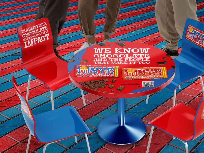 Event design and experiential marketing display for Tony's Chocolonely, branded table and chairs setup for trade shows and retail promotions
