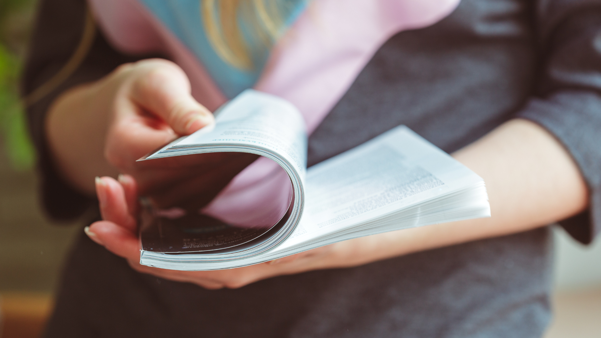 Person reading booklet