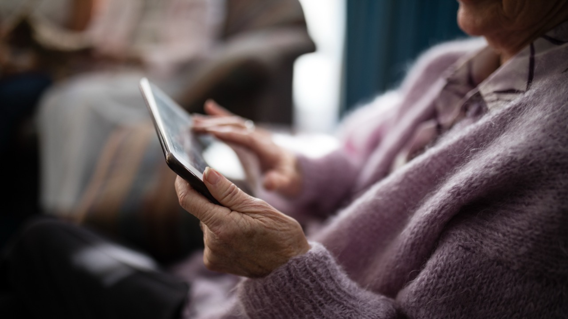 Older adult using tablet