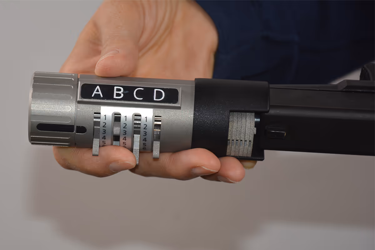 Holding SafeGunLock to enter code