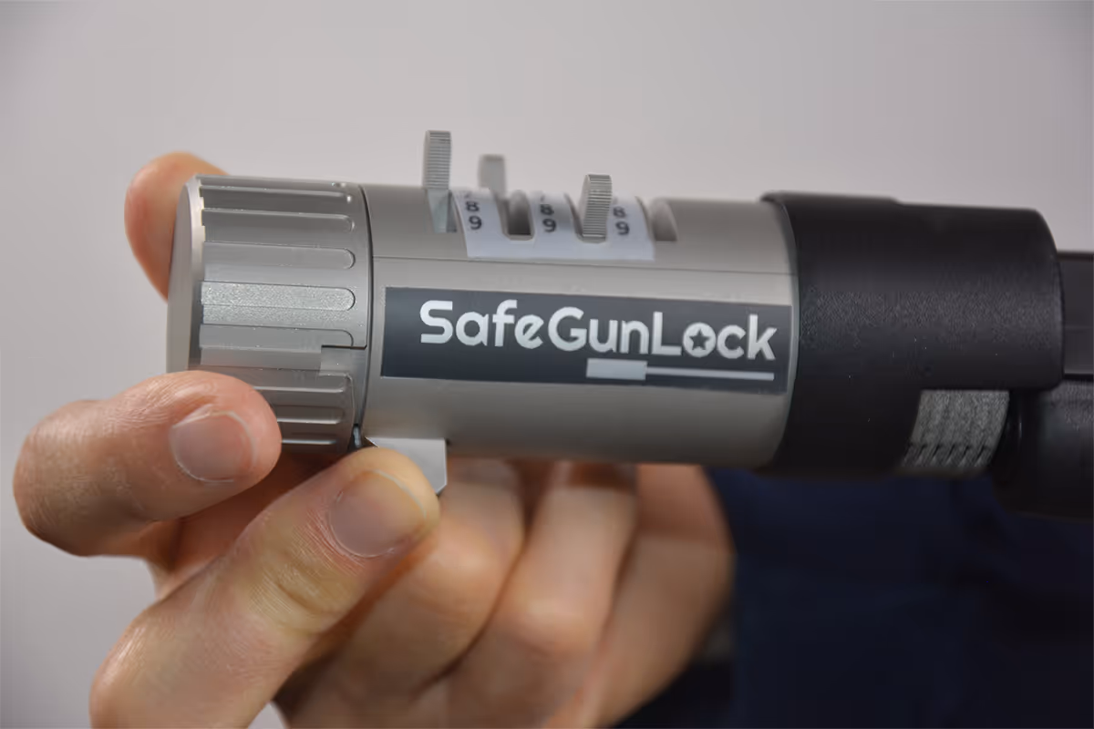 Turning lock dials to unlock SafeGunLock