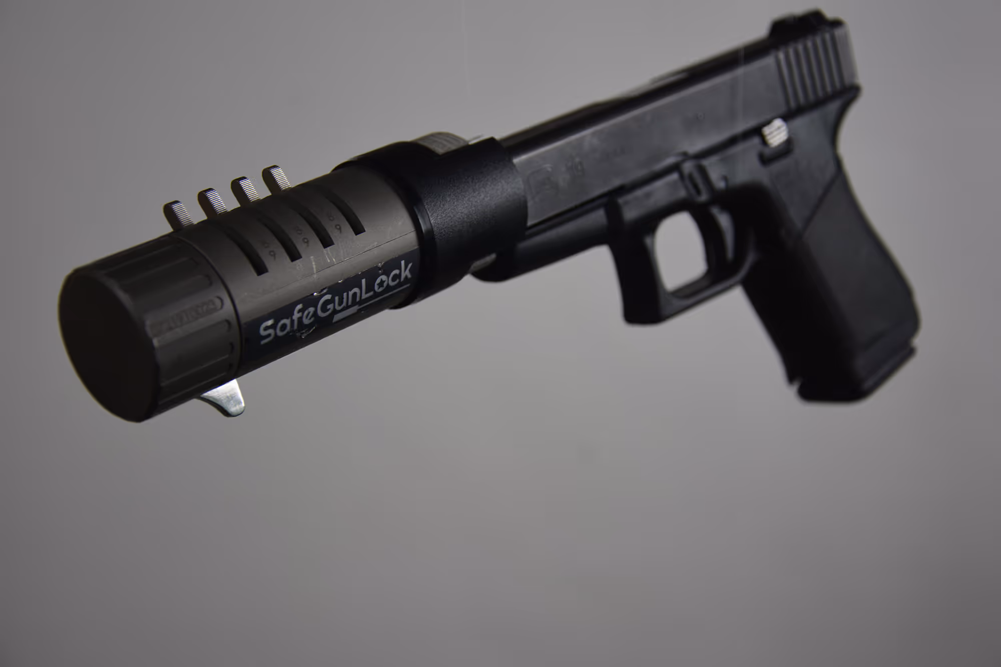 SafeGunLock inserted into handgun