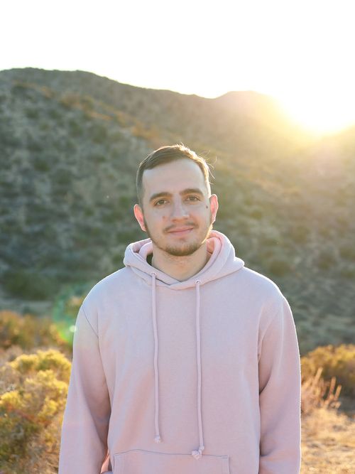 Alex standing on a hill in the Joshua Tree Park.