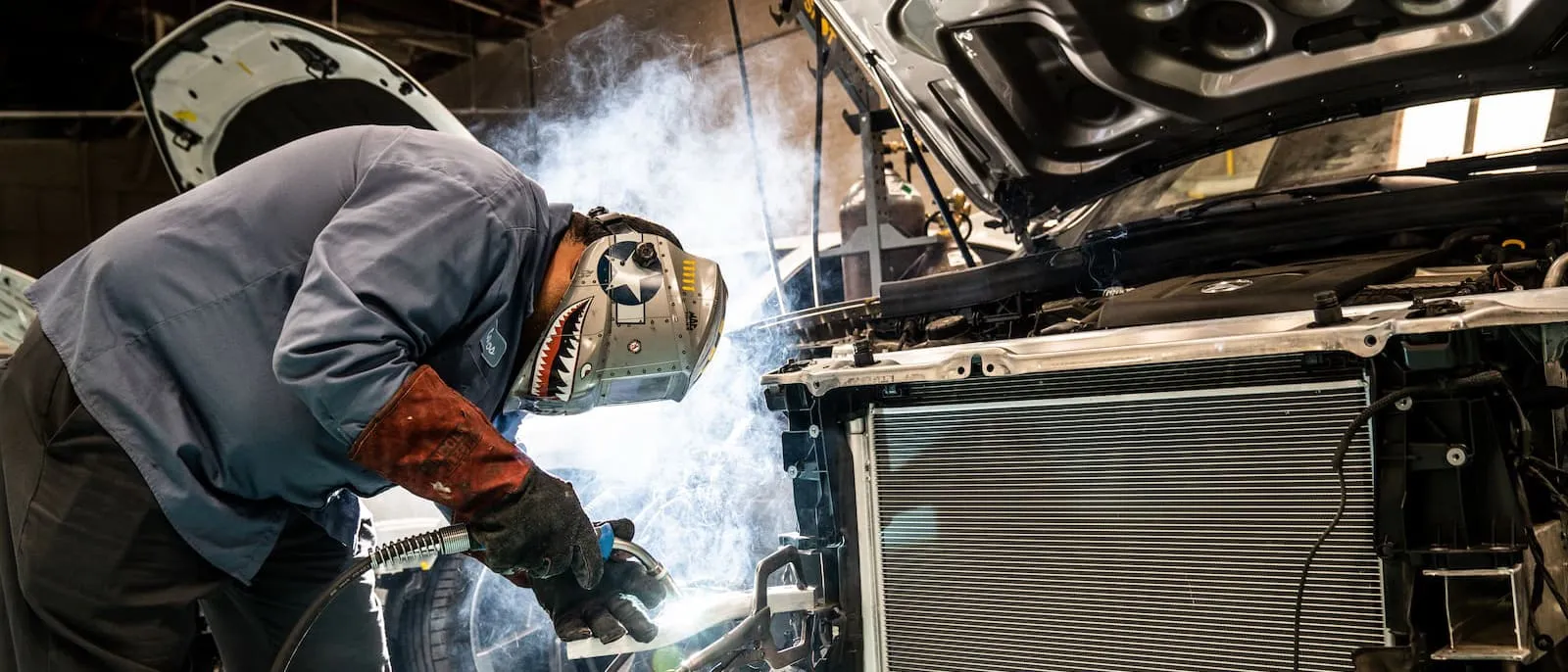 Photo of person doing car work