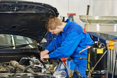 Mechanic giving maintenance to the car