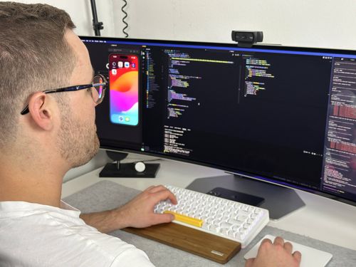 Matti sitting at the computer, typing on keyboard