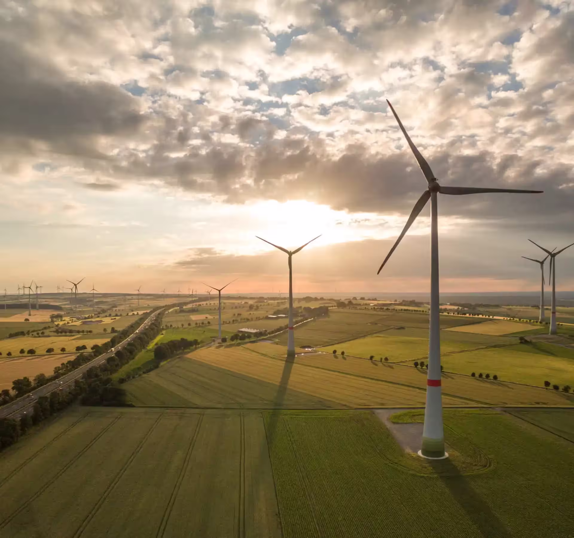 wind turbines on fields sun