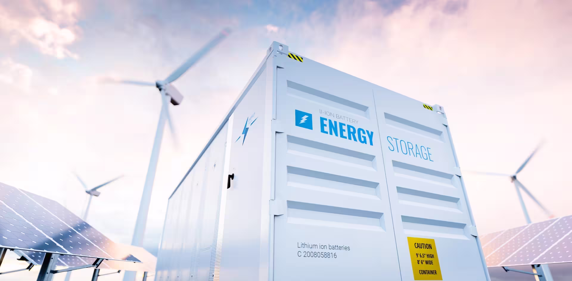 Windmills, solar panels and energy storage container in front of sky smarter e conference