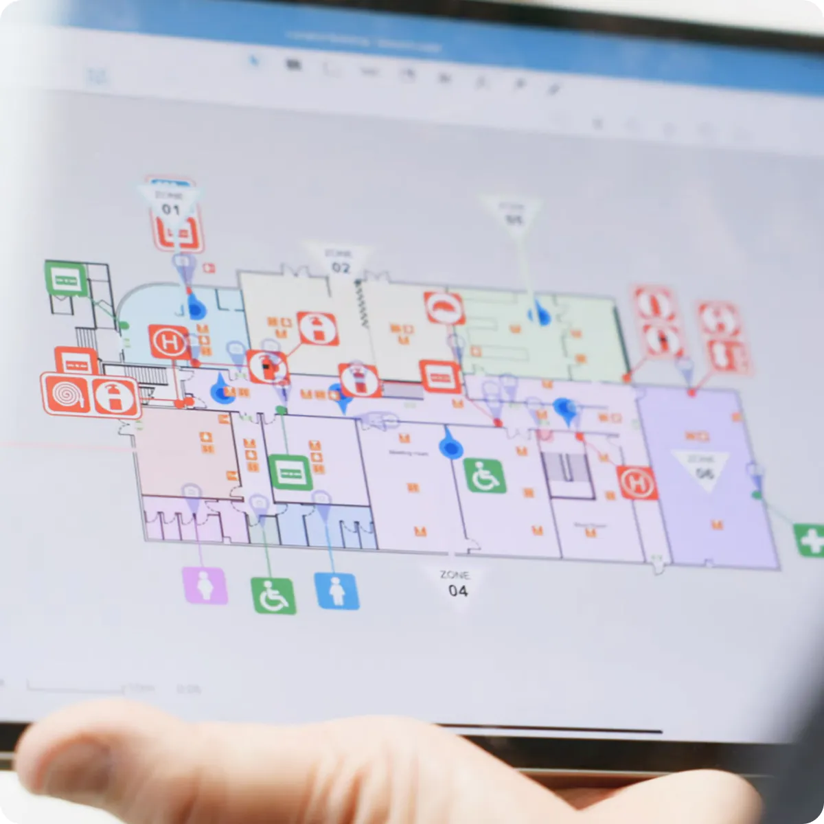 A hand holding a floor plan.