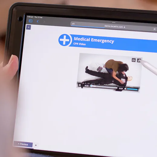 A person using a medical emergency app on a tablet.