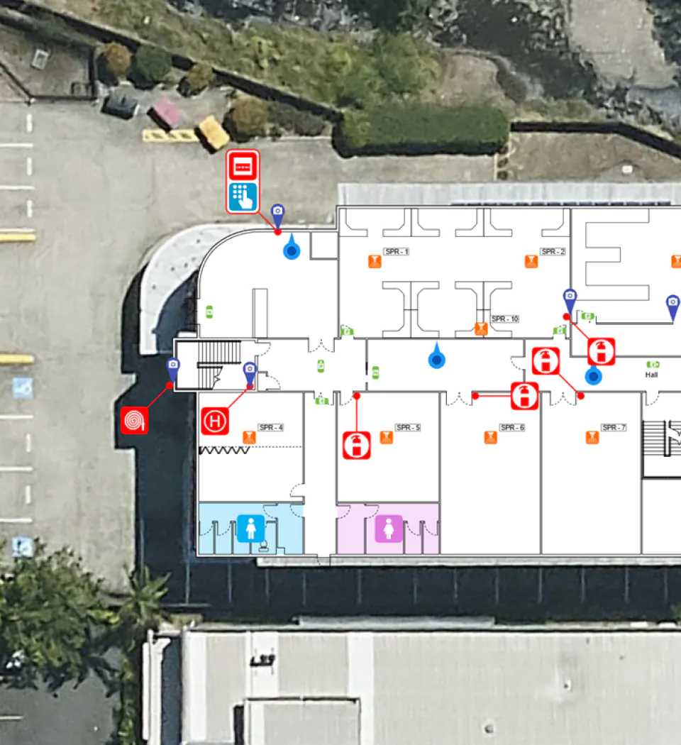 Aerial view of a building floor plan overlaid on a satellite image, showing fire safety and emergency.