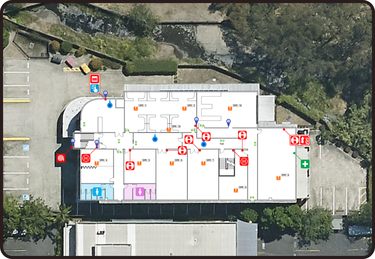 An aerial view of a commercial building and parking lot with a detailed digital floor plan overlaid on top.