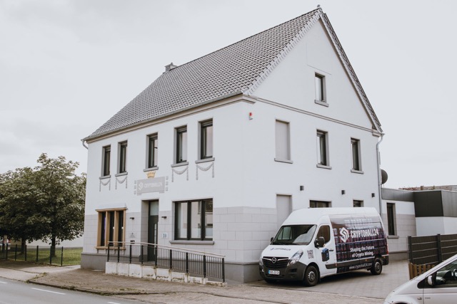 Cryptohall24 headquarters: building with van outside - Cryptohall24