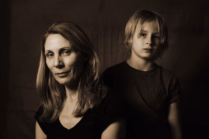 A woman and a boy in sepia colours