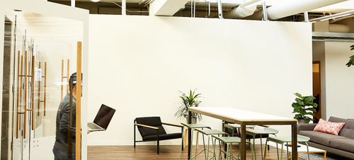 Two members of the team at WeaveGrid having a brainstorming discussion in our San Francisco office.