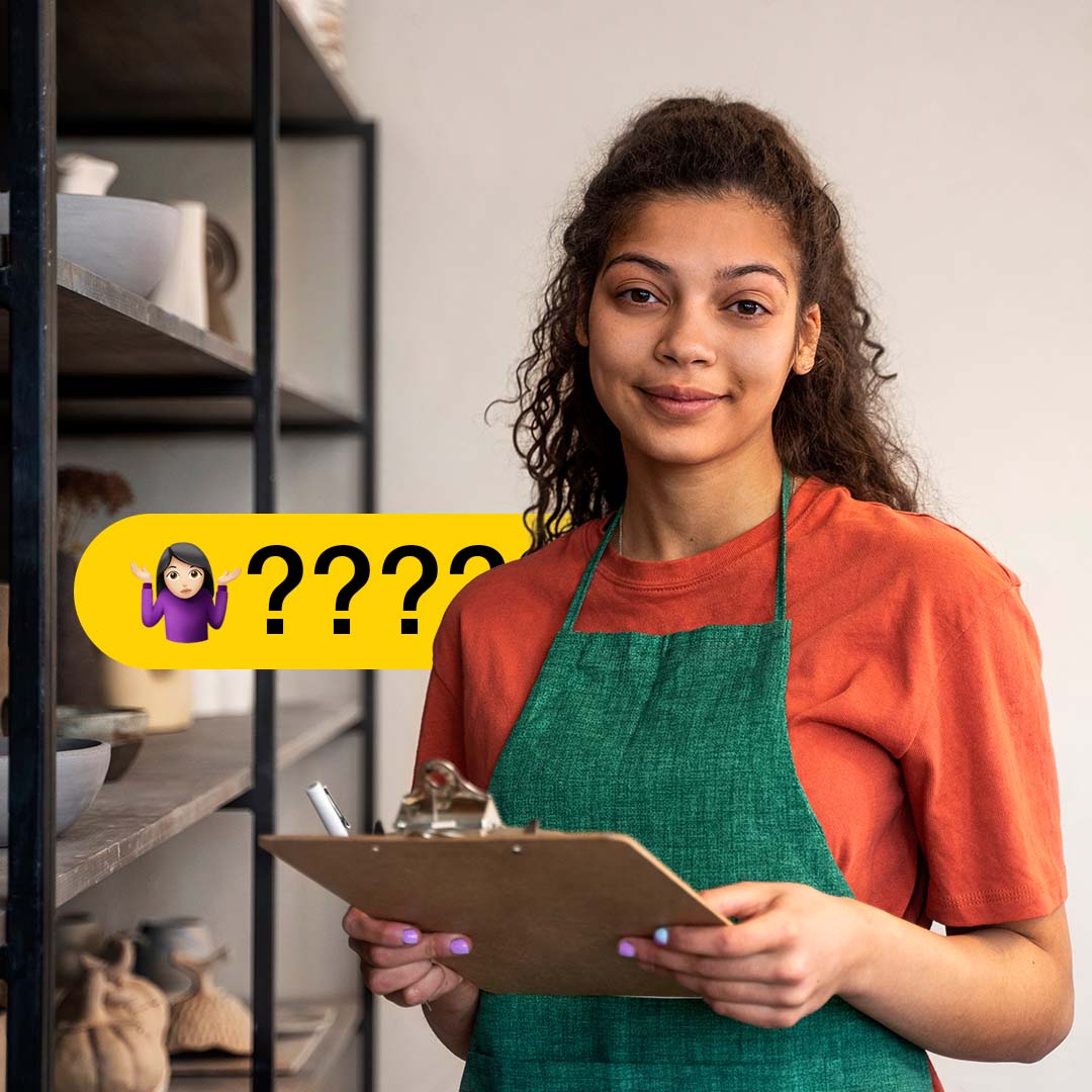 Business owner wearing green apron